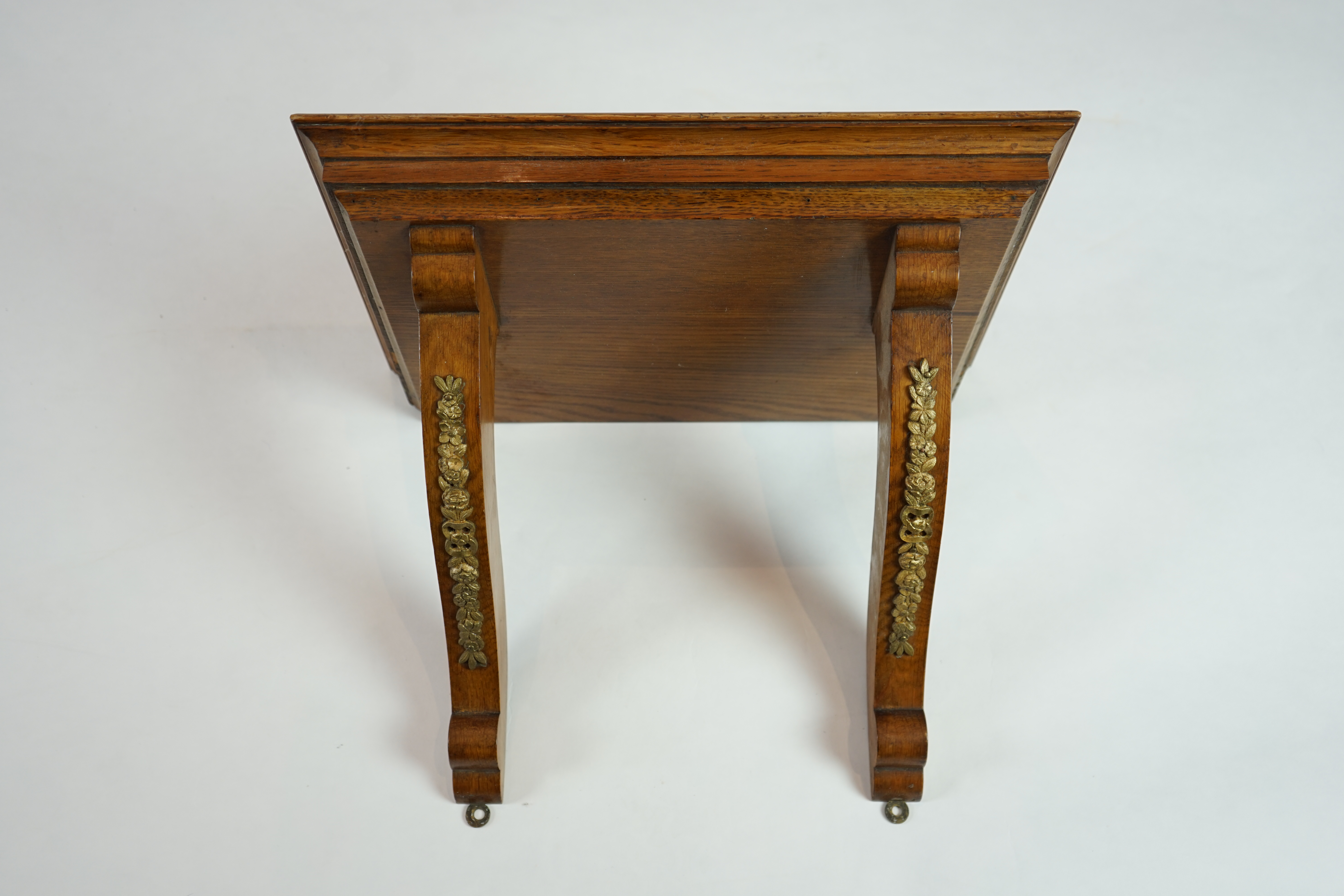 A late Victorian ormolu mounted golden oak cased eight day chiming bracket clock and bracket